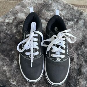 They're Back!!😋  brand, new black and white Heely's USA youth size 4.